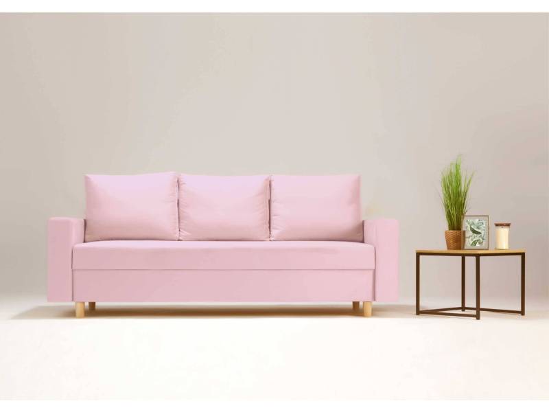 Różowa sofa w tylu skandynawskim