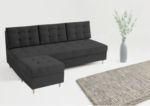 Czarna sofa pikowana z pufą