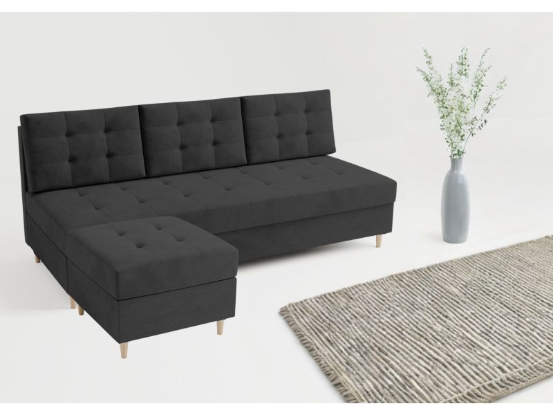 Czarna sofa pikowana z pufą